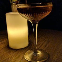 a glass of wine on a table