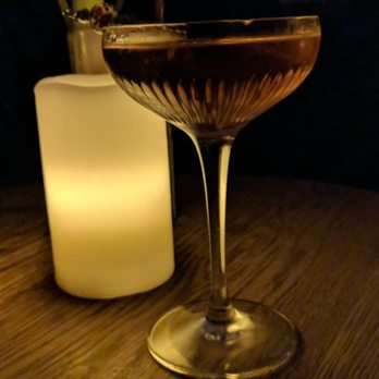Gift Shop - a glass of wine on a table - Cocktail Bars Near Me - Toronto, Ontario