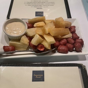 Emporium Brasil - Fried yucca and sausage (Linguica com Mandioca) - Brazilian Near Me - New York, New York Emporium Brasil - Fried yucca and sausage (Linguica com Mandioca) - Brazilian Near Me - New York, New York