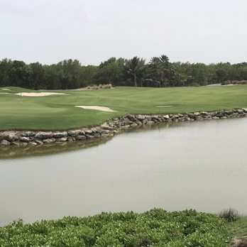 Riviera Cancun Golf Club - 18th hole view from the clubhouse. A 3 shot par 5. Stay right off the tee. Long iron lay up and then Blammo! Birdie time! - Golf Near Me - Cancún, ROO Riviera Cancun Golf Club - 18th hole view from the clubhouse. A 3 shot par 5. Stay right off the tee. Long iron lay up and then Blammo! Birdie time! - Golf Near Me - Cancún, ROO