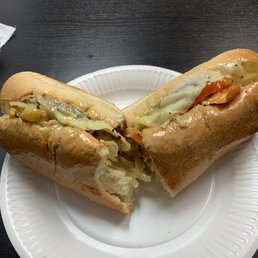 Cheeseburger Sub on white with provolone, onions, hot peppers and honey mustard. Missing one bite because I was hungry.
