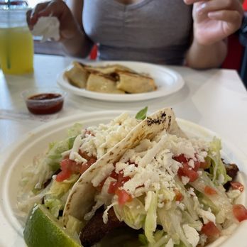 Locoz Tacoz - Fried fish tacos on flour tortillas (front) and a shrimp quesadilla (back) - Tacos Near Me - St. Louis, Missouri Locoz Tacoz - Fried fish tacos on flour tortillas (front) and a shrimp quesadilla (back) - Tacos Near Me - St. Louis, Missouri
