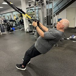 Institute For Health Management - Client using TRX suspension training for strength and conditioning.