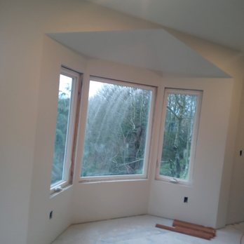 Jose General Construction - a room with three large windows - General Contractors Near Me Jose General Construction - a room with three large windows - General Contractors Near Me