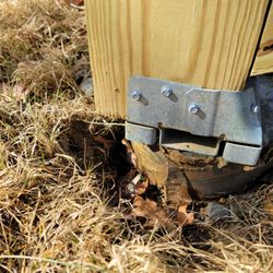 Southers Construction - Support leg hanging off footer, code viilation