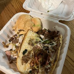 Caruso's Pizza - Cheesesteak with lettuce & onions with extra toppings like ham and mushrooms which we didn't order.