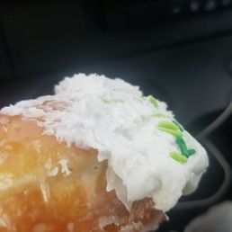 a hand holding a donut a hand holding a donut