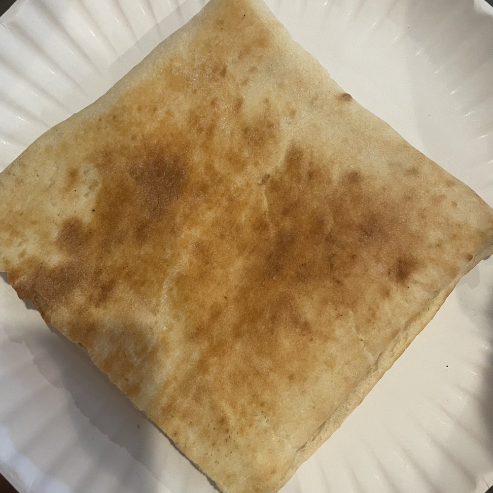 Half of a panini, just cheese (not on menu - ask them to make a panini with just cheese).