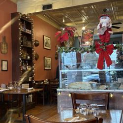 Aquila Pizza Al Forno - View from front to the center where the wood fire oven is and chef making everything to order from scratch