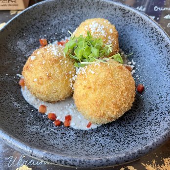Tryzub Ukrainian Kitchen - New Style Banosh (think amazing comfort food) Fried cheese stuffed polenta balls. - Ukrainian Near Me - Chicago, Illinois Tryzub Ukrainian Kitchen - New Style Banosh (think amazing comfort food) Fried cheese stuffed polenta balls. - Ukrainian Near Me - Chicago, Illinois