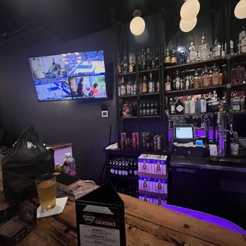 Hott Wings - a bar with a television and a television screen - Chicken Wings Near Me - Edmond, Oklahoma Hott Wings - a bar with a television and a television screen - Chicken Wings Near Me - Edmond, Oklahoma