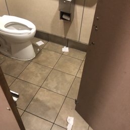 Messy men's room stall.