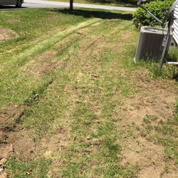 Sanitary Sewer Service - Ruts left in my lawn from the heavy equipment Sanitary used that lead to the crack in our foundation.