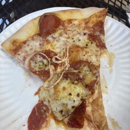 Aa slice of the pizza we bought a pepperoni pizza Aa slice of the pizza we bought a pepperoni pizza