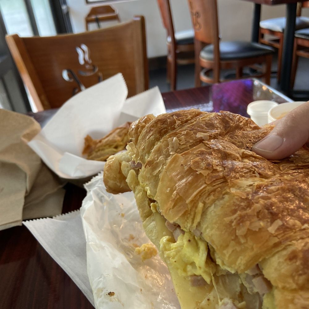 Pinecrest Bakery - Key Largo - Breakfast menu: scrambled egg, ham and swiss Sunshine Croissant (it's a 2-hand breakfast sammie!) - Bakeries Near Me - Key Largo, Florida Pinecrest Bakery - Key Largo - Breakfast menu: scrambled egg, ham and swiss Sunshine Croissant (it's a 2-hand breakfast sammie!) - Bakeries Near Me - Key Largo, Florida