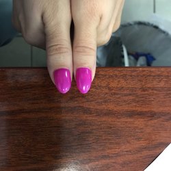 Harmony Spa & Nails - Thumbs- round and short on one, tapered tip and longer on the other. Simple check would have taken care of this