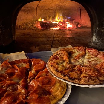 Eat Fire Pizza - two pizzas in front of a fire - Pizza Near Me Eat Fire Pizza - two pizzas in front of a fire - Pizza Near Me