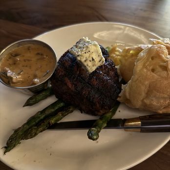 Daylene's Supper Club - Filet mignon that came with a salad, asparagus, and an additional side we upgraded and got the cognac mushroom sauce, which was delectable - Bars Near Me - Wisconsin Dells, Wisconsin Daylene's Supper Club - Filet mignon that came with a salad, asparagus, and an additional side we upgraded and got the cognac mushroom sauce, which was delectable - Bars Near Me - Wisconsin Dells, Wisconsin