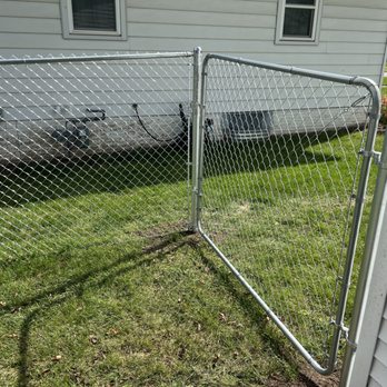 Morgan Home Solutions - a chain link fence in front of a house - General Contractors Near Me Morgan Home Solutions - a chain link fence in front of a house - General Contractors Near Me