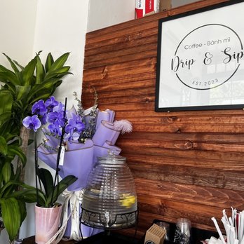 Drip & Sip - a wooden wall with a sign above it - Coffee & Tea Near Me - Tukwila, Washington