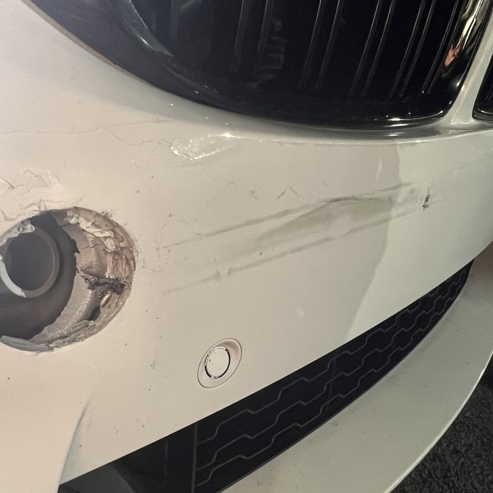Fix Auto Lake Forest - Damaged bumper before repair Missing tow hook cover - Body Shops Near Me - Lake Forest, California Fix Auto Lake Forest - Damaged bumper before repair Missing tow hook cover - Body Shops Near Me - Lake Forest, California