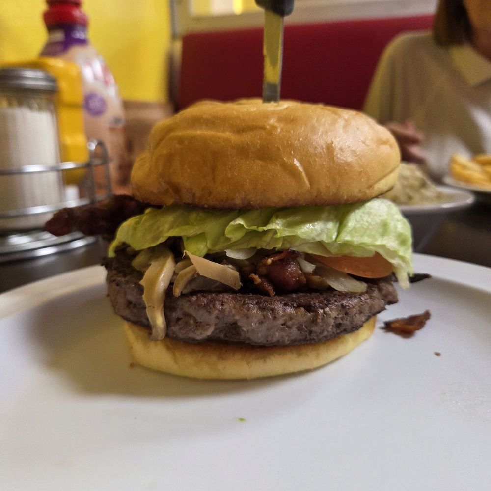 Mom's Diner - Mom-strosisty Burger! There is cheese on it... it just oozed on the other side. The mystery sauce is delicious!! - Diners Near Me - Pahrump, Nevada Mom's Diner - Mom-strosisty Burger! There is cheese on it... it just oozed on the other side. The mystery sauce is delicious!! - Diners Near Me - Pahrump, Nevada