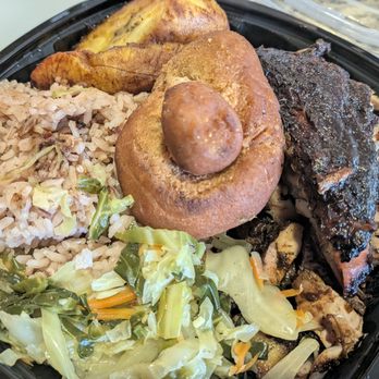 Chef Bigwayne Jamaican Cuisine - Jerk chicken meal, $23.75. Big container, mostly bland/mushy rice underneath. Four bites of cabbage. Really disappointing. - Caribbean Near Me - Buffalo, New York