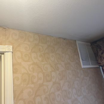 Hilton Garden Inn Casper - Old wallpaper with air vent partially covered by curtain causing the fabric to flap 24/7 - Hotels Near Me - Casper, Wyoming Hilton Garden Inn Casper - Old wallpaper with air vent partially covered by curtain causing the fabric to flap 24/7 - Hotels Near Me - Casper, Wyoming