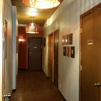Wan Q - a long hallway with a lamp hanging from the ceiling - Chinese Near Me - Portland, Oregon Wan Q - a long hallway with a lamp hanging from the ceiling - Chinese Near Me - Portland, Oregon