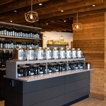 The Oil Tree - a counter with a variety of bottles of wine - Specialty Food Near Me - Oklahoma City, Oklahoma The Oil Tree - a counter with a variety of bottles of wine - Specialty Food Near Me - Oklahoma City, Oklahoma
