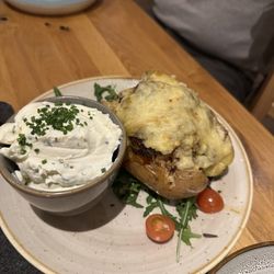 joHanns Hof - Baked Potato with Pulled Pork and Cheese, Sour Cream on the Side