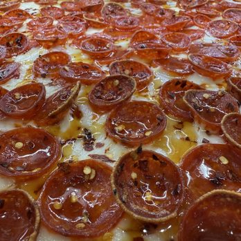 Emilio's Stone Fired Pizzeria - Pepperoni Hot Honey with Pepper flakes - Pizza Near Me - Darien, Connecticut Emilio's Stone Fired Pizzeria - Pepperoni Hot Honey with Pepper flakes - Pizza Near Me - Darien, Connecticut