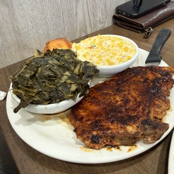 His Place Eatery - Pork Chop with collard greens and bourbon creamed corn. - Southern Near Me - Indianapolis, Indiana