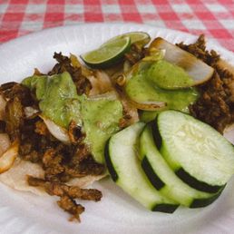 Asada Taco with Cooked onion and avocado sauce Asada Taco with Cooked onion and avocado sauce