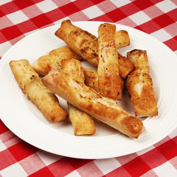 241 Pizza - a plate of fried breadsticks on a red and white checkered tablecloth - Pizza Near Me - Gananoque, Ontario