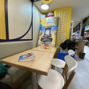 Pan Store Kitchen & Market - Interior of stall's seating, to the left of the cash register. Don't sit across from the stall - we were told not to! - Restaurants Near Me - Madrid, M