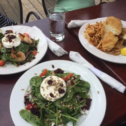 Two spinach salads, one with shrimp, and fish & chips. Two spinach salads, one with shrimp, and fish & chips.