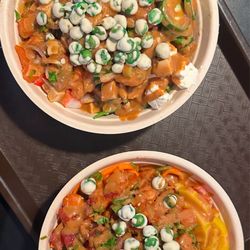 PokéBowl Cafe - Poke bowl with salmon and tuna , white rice, seaweed salad, Kani, soy dressing and wasabi peas on top for crunch