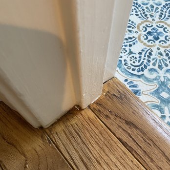 Elegant Floor Services - While the open floor was sanded no care was taken to sand close to the walls. Stain was just applied over top the old flooring stain! - Flooring Near Me - Silver Spring, Maryland