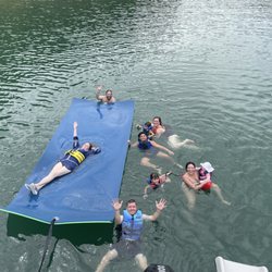 Panther Bay Marina - Our family enjoying the rental with slide and Lilly pad