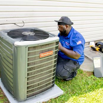 Johnson Heating, Cooling, and Plumbing - Technician Checking A/C unit. - Plumbing Near Me - Franklin, Indiana Johnson Heating, Cooling, and Plumbing - Technician Checking A/C unit. - Plumbing Near Me - Franklin, Indiana