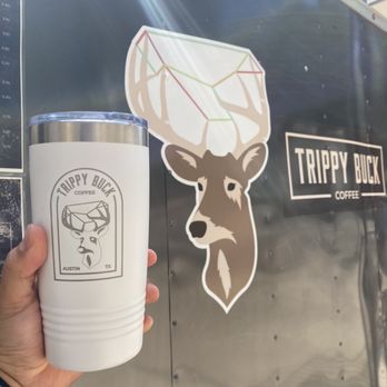 Trippy Buck Coffee - a hand holding a cup - Coffee & Tea Near Me - Austin, Texas