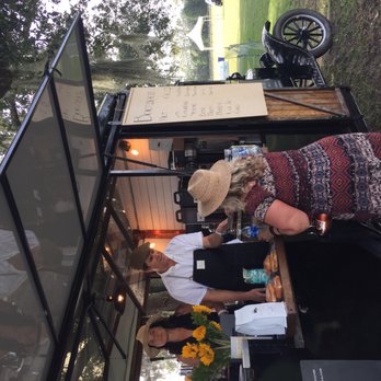 Bootlegger Coffee Co. - two people standing at a table with a coffee machine in the background - Food Trucks Near Me Bootlegger Coffee Co. - two people standing at a table with a coffee machine in the background - Food Trucks Near Me