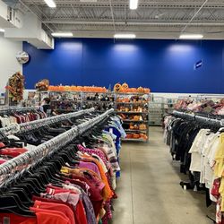 Goodwill - Looking down a women's clothing aisle at the Halloween section