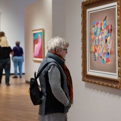 Museum of Art + Light - A museum visitor viewing Anatole Krasnyansky's No Stranger to Music #1 (n.d 20th c.).