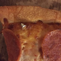 An earring back we found in our pizza. We will not be coming back here. An earring back we found in our pizza. We will not be coming back here.