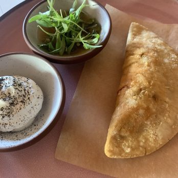 Mercado Gonzalez - PESCADILLA Fried corn empanada, smoked tuna sofrito, sour cream, lime sauce - Mexican Near Me - Costa Mesa, California Mercado Gonzalez - PESCADILLA Fried corn empanada, smoked tuna sofrito, sour cream, lime sauce - Mexican Near Me - Costa Mesa, California