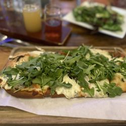 Derailed Pour House - Arugula goat cheese flatbread