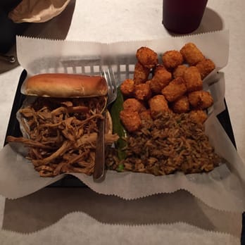 Satchmo's - Pulled pork sandwich with dirty rice and tots. - Cajun/Creole Near Me - Flagstaff, Arizona