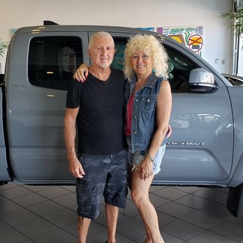 Camelback Toyota - Customer Rich and his wife Deb enjoying the moment buying this vehicle. Hip Hip Hurray! Thanks Moose, Richie, and Ali. - Car Dealers Near Me - Phoenix, Arizona